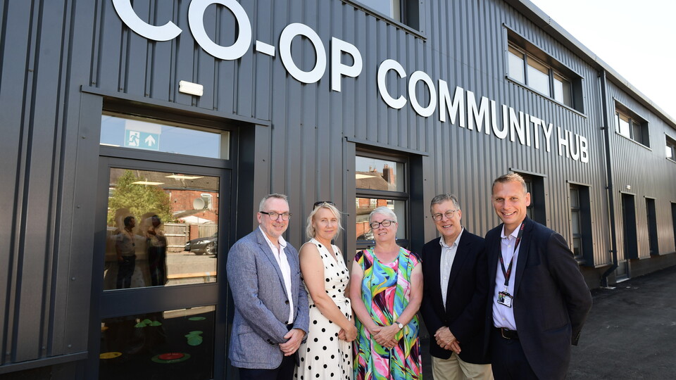 Board of trustees outside the Co-op Community Hub.