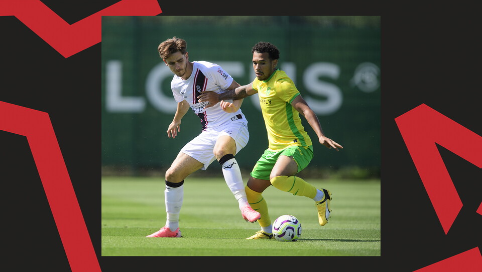 Tom Bayliss challenges for the ball