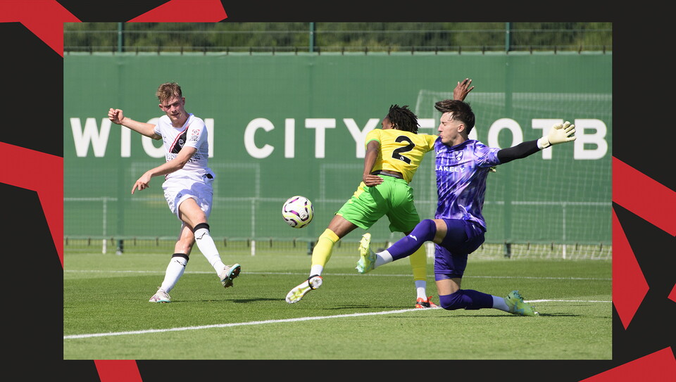 JJ McKiernan has a shot which is blocked by a Norwich City defender and goalkeeper