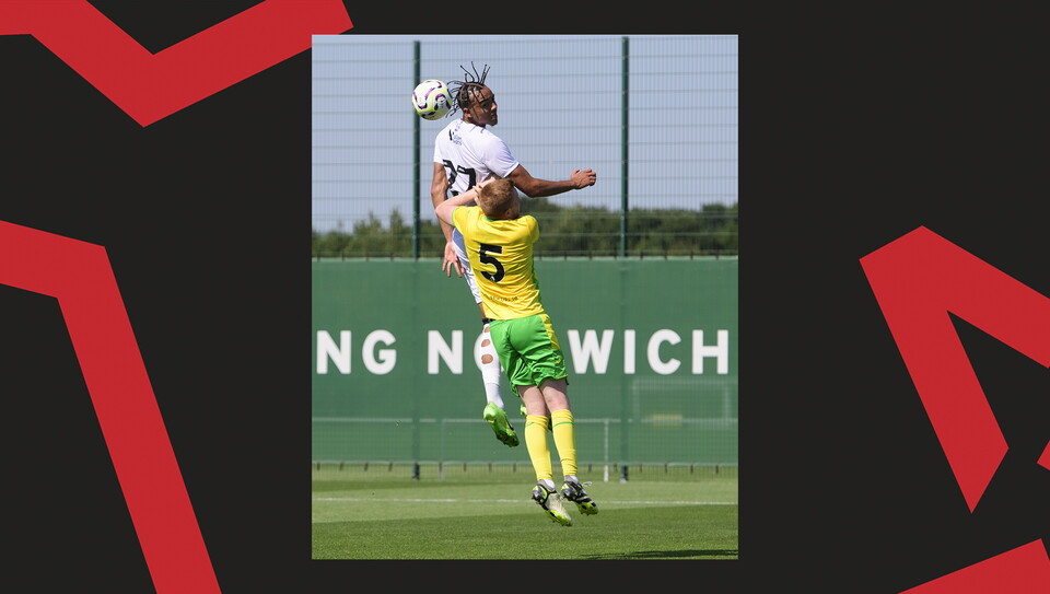 Jovon Makama jumps much higher than a Norwich City defender and wins a header