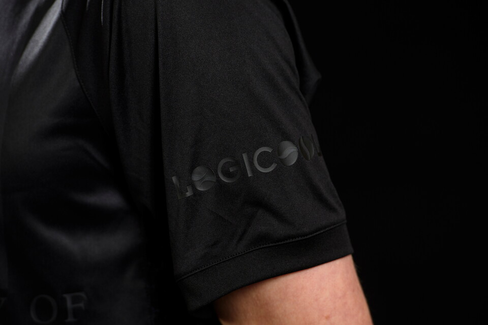 A close up of Logicool on the sleeve of Lincoln City's all-black third kit for 2024/25