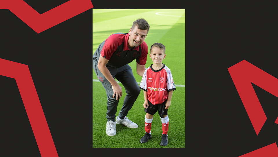 Young fans enjoying a matchday experience at Lincoln City's home game against Wigan Athletic.