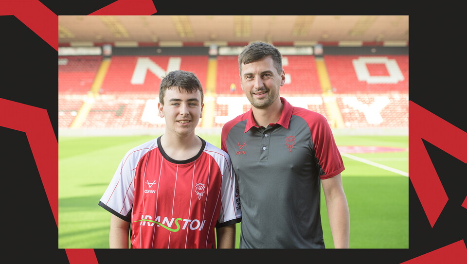 Young fans enjoying a matchday experience at Lincoln City's home game against Wigan Athletic.