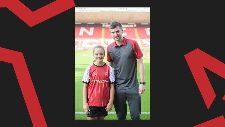 Young fans enjoying a matchday experience at Lincoln City's home game against Wigan Athletic.