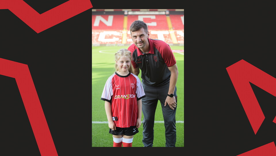 Young fans enjoying a matchday experience at Lincoln City's home game against Wigan Athletic.