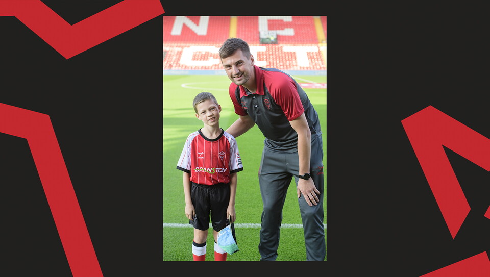 Young fans enjoying a matchday experience at Lincoln City's home game against Wigan Athletic.