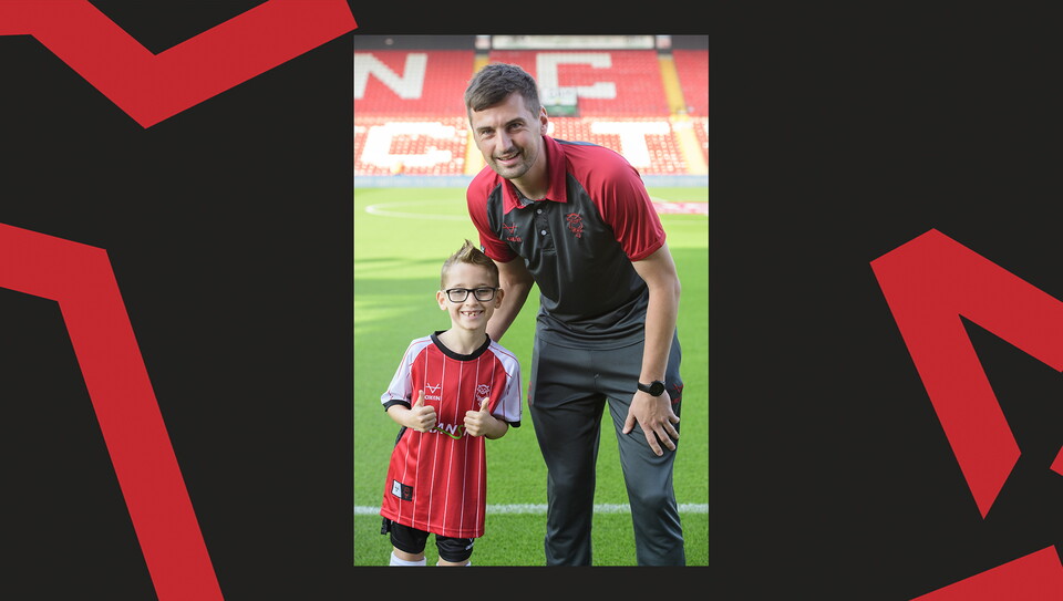 Young fans enjoying a matchday experience at Lincoln City's home game against Wigan Athletic.