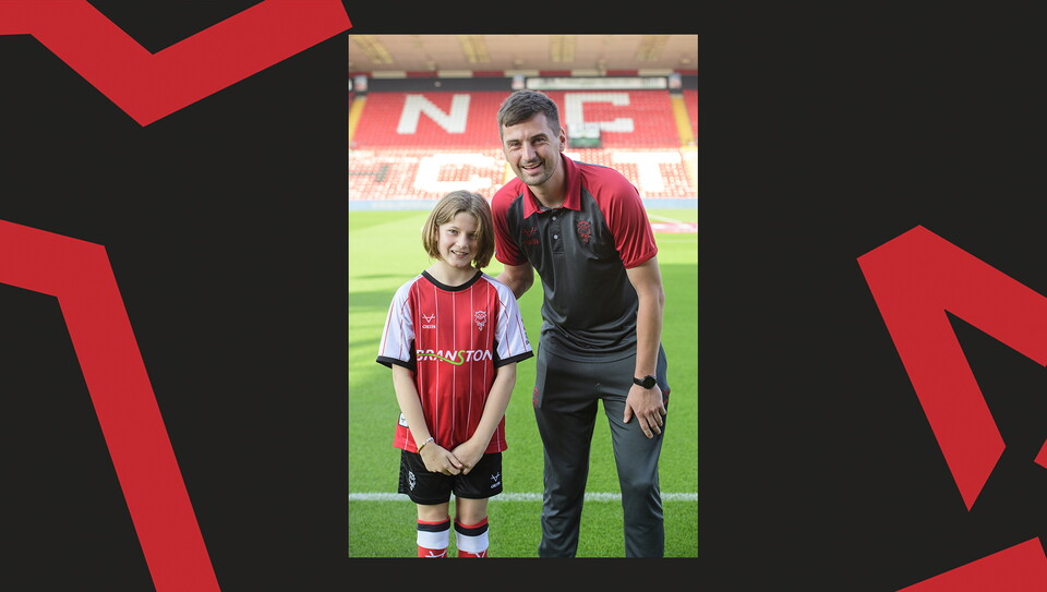 Young fans enjoying a matchday experience at Lincoln City's home game against Wigan Athletic.