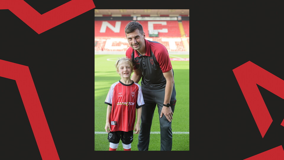 Young fans enjoying a matchday experience at Lincoln City's home game against Wigan Athletic.