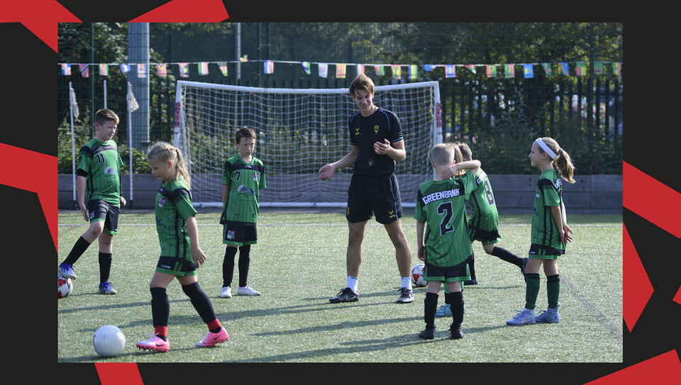 Young fans enjoying a matchday experience at Lincoln City's home game against Wigan Athletic.