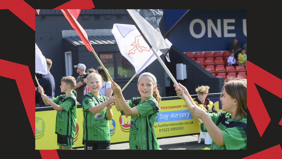 Young fans enjoying a matchday experience at Lincoln City's home game against Wigan Athletic.