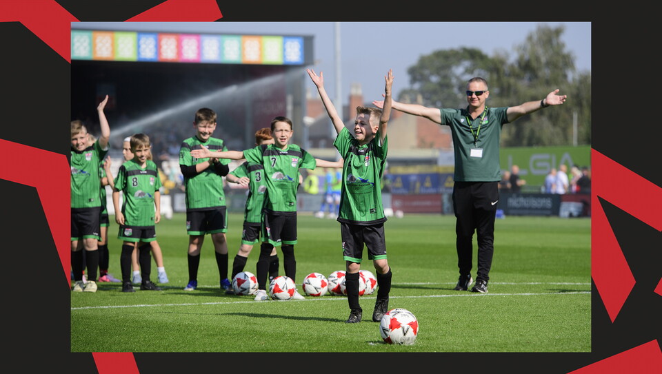 Young fans enjoying a matchday experience at Lincoln City's home game against Wigan Athletic.
