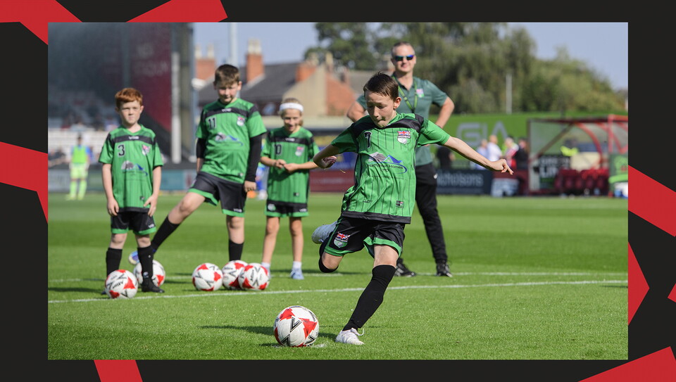 Young fans enjoying a matchday experience at Lincoln City's home game against Wigan Athletic.