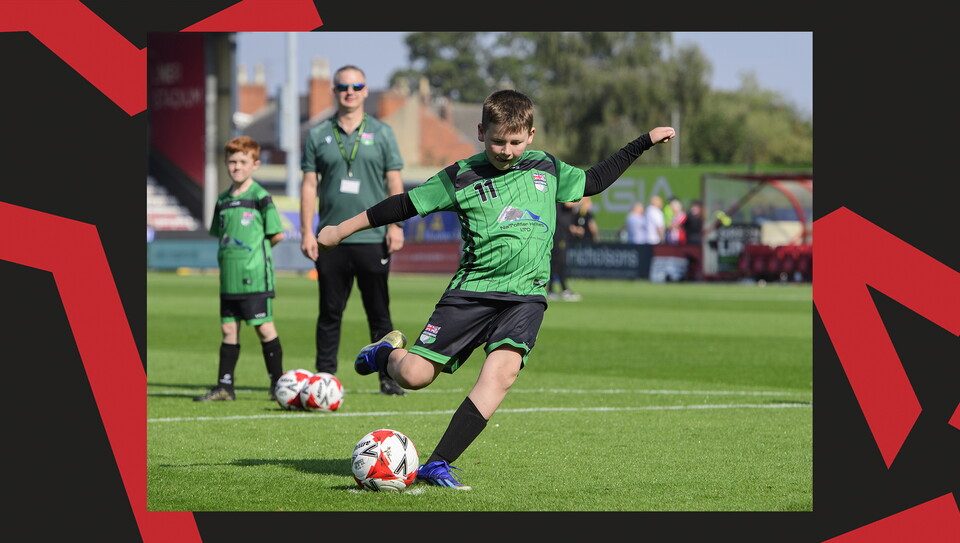 Young fans enjoying a matchday experience at Lincoln City's home game against Wigan Athletic.