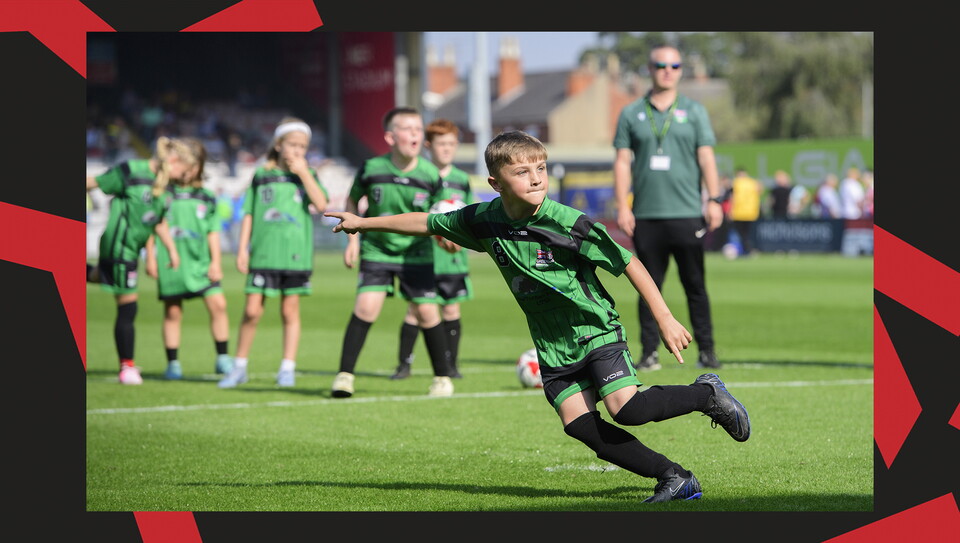 Young fans enjoying a matchday experience at Lincoln City's home game against Wigan Athletic.