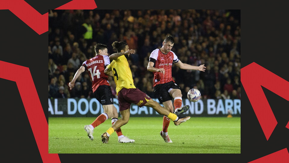 A match action image from Lincoln City's 2-1 home win over Northampton Town
