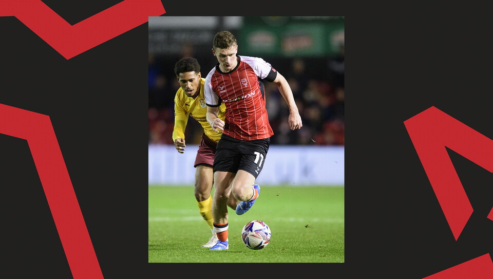 A match action image from Lincoln City's 2-1 home win over Northampton Town