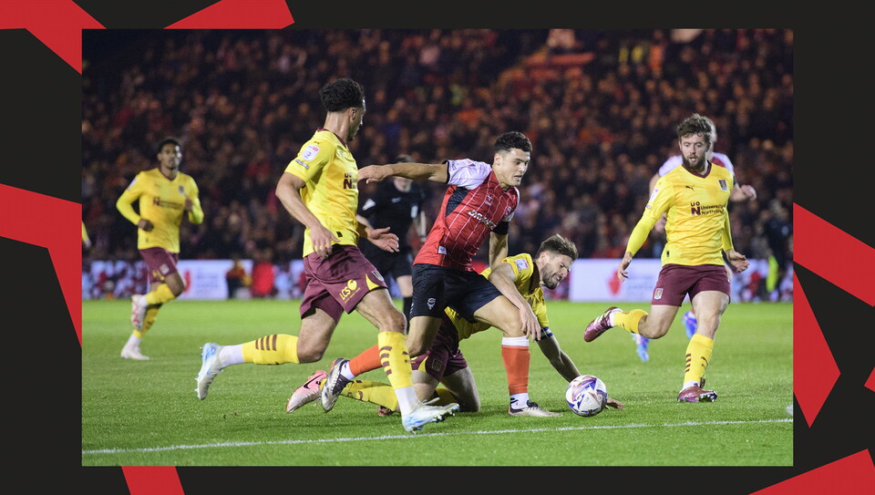 A match action image from Lincoln City's 2-1 home win over Northampton Town