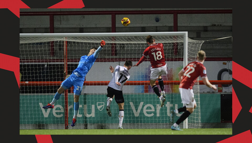 A match action image from the Imps' away Vertu Trophy game at Morecambe