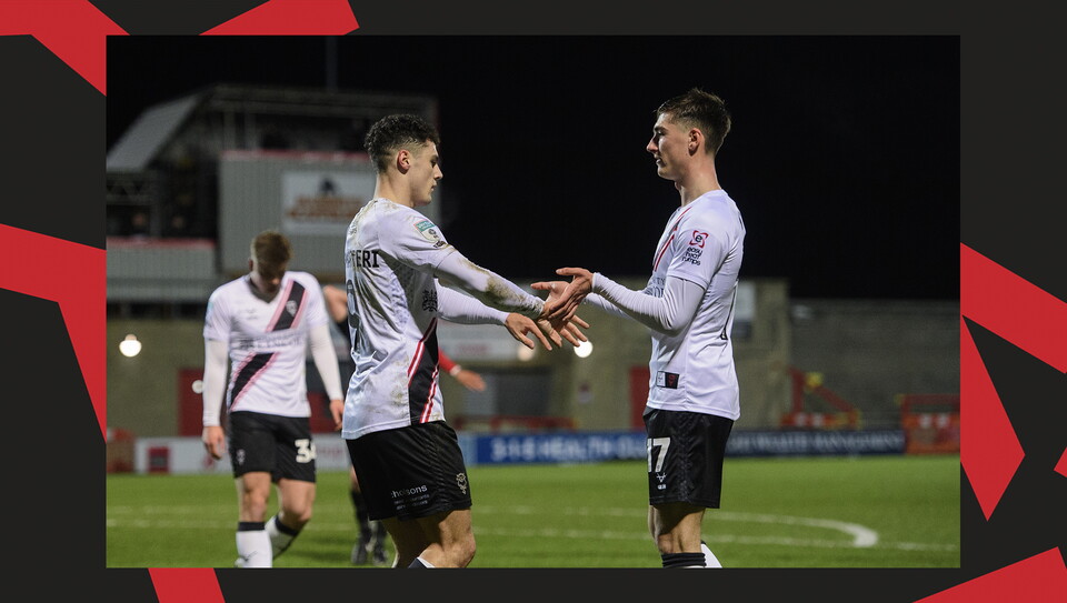 A match action image from the Imps' away Vertu Trophy game at Morecambe