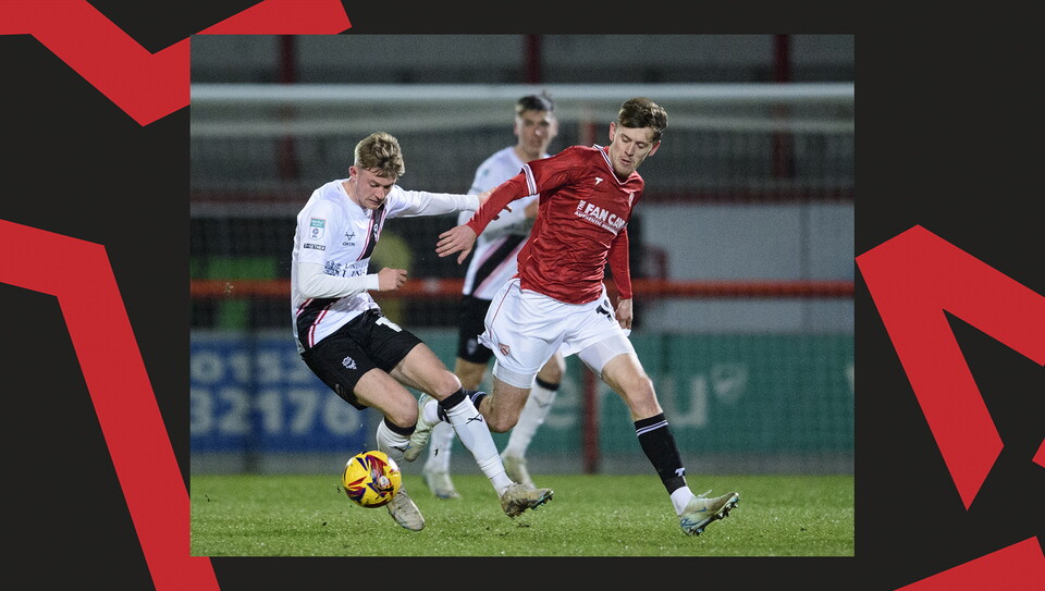 A match action image from the Imps' away Vertu Trophy game at Morecambe