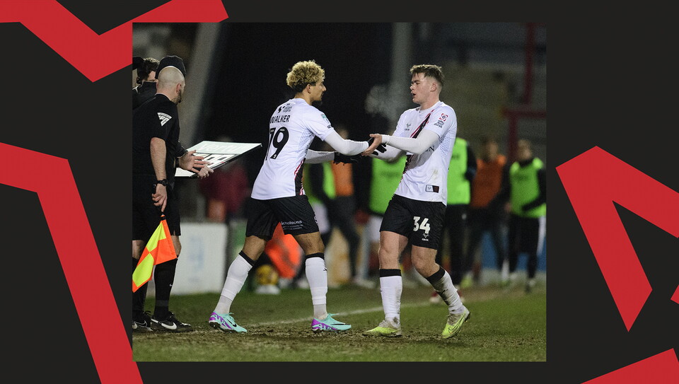 A match action image from the Imps' away Vertu Trophy game at Morecambe