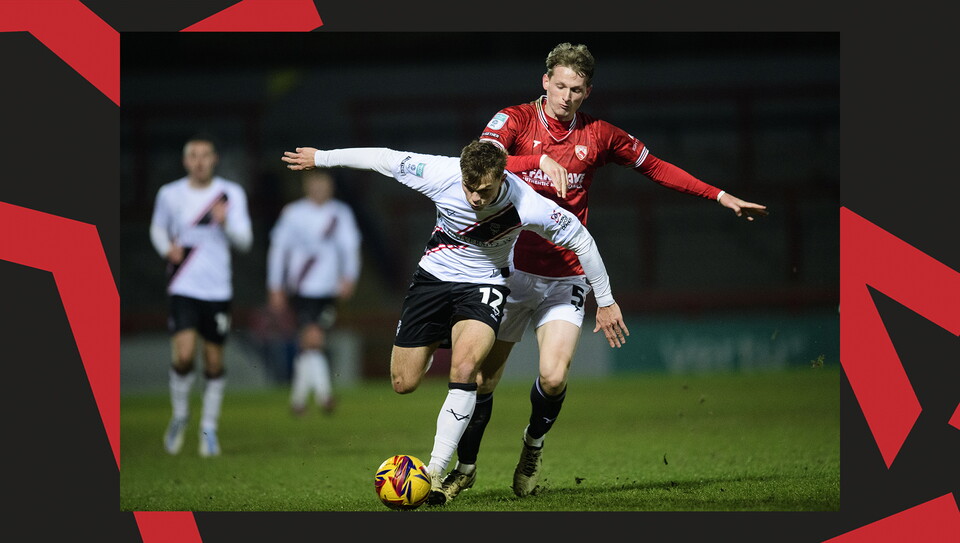 A match action image from the Imps' away Vertu Trophy game at Morecambe