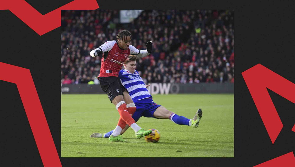 Match action from Lincoln CIty's 2-0 win over Reading.
