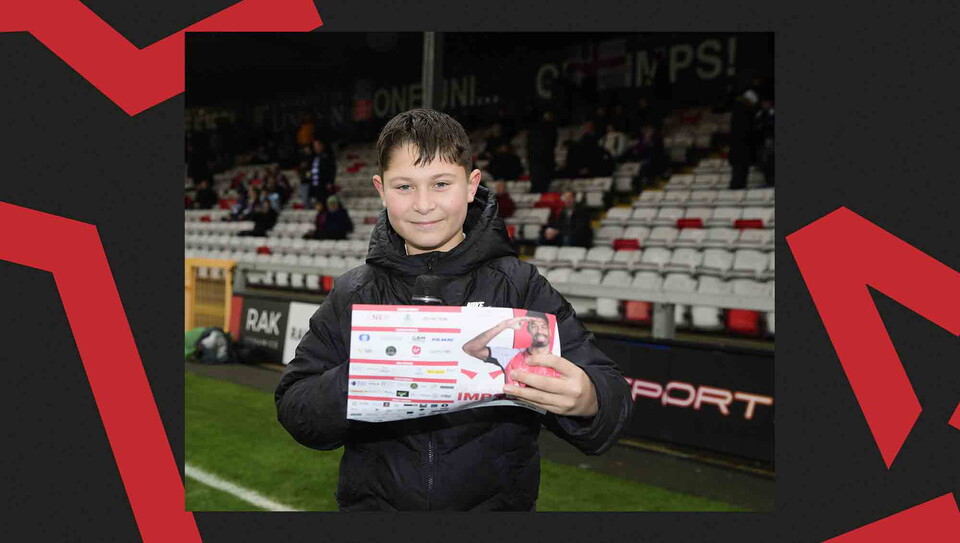 A fan reads out the teamsheet