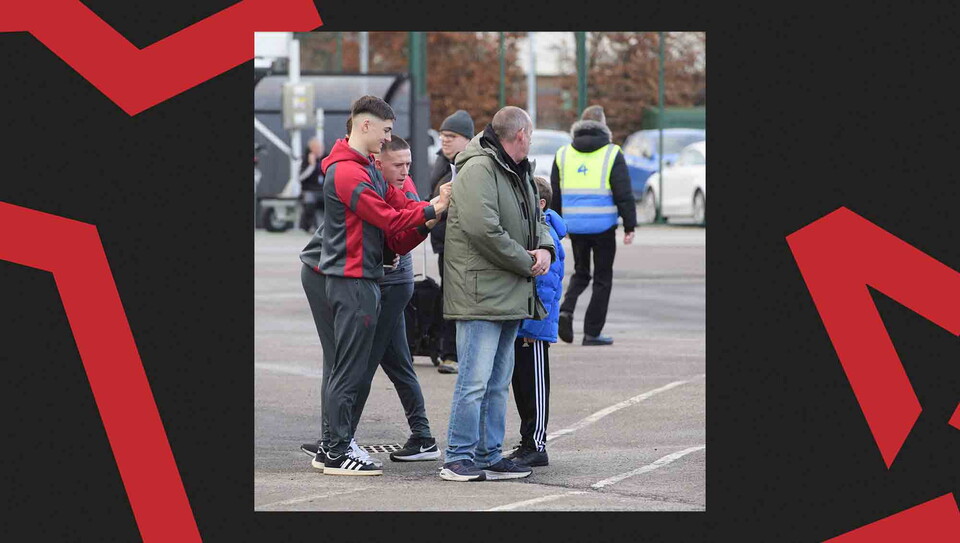 Fans pose for a photo before the game.