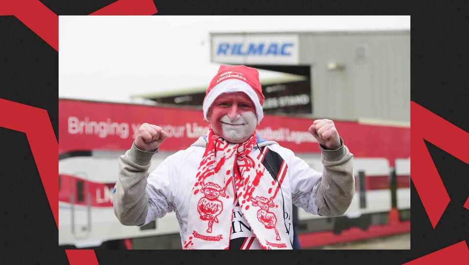 Fans pose for a photo before the game.