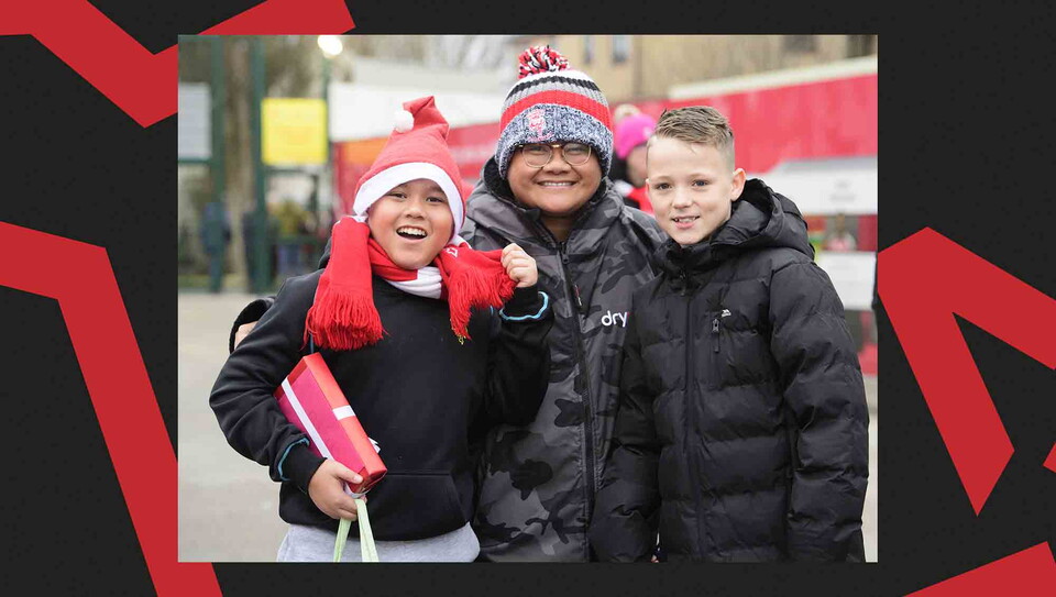 Fans pose for a photo before the game.