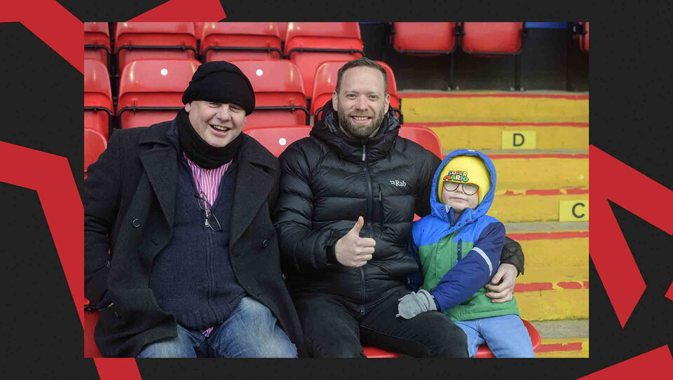 Fans pose for a photo before the game.