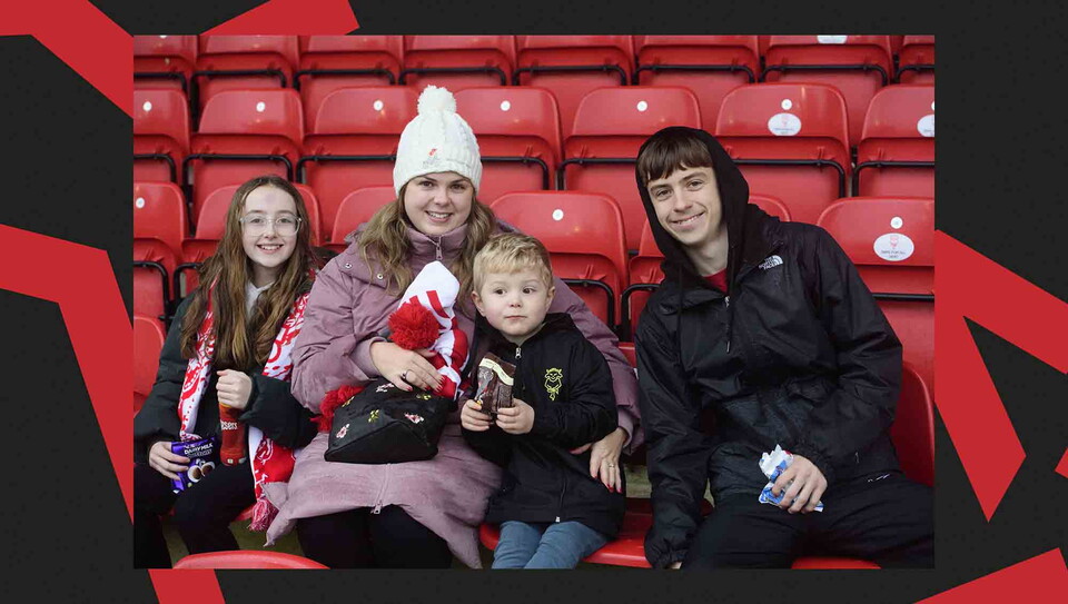 Fans pose for a photo before the game.