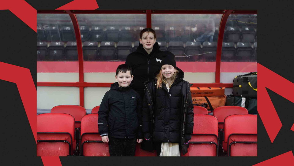 Fans pose for a photo before the game.