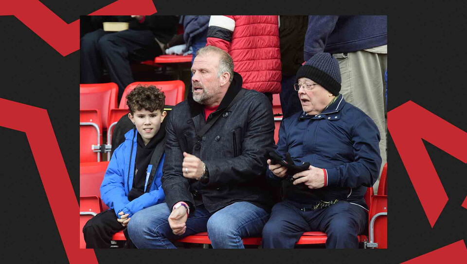 Fans pose for a photo before the game.