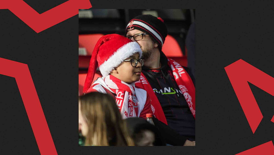 Lincoln City fans watching a game