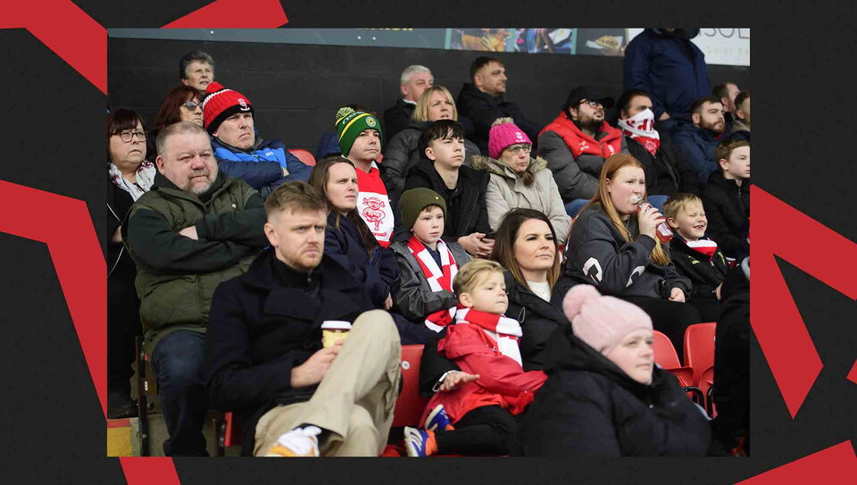 Lincoln City fans watching a game