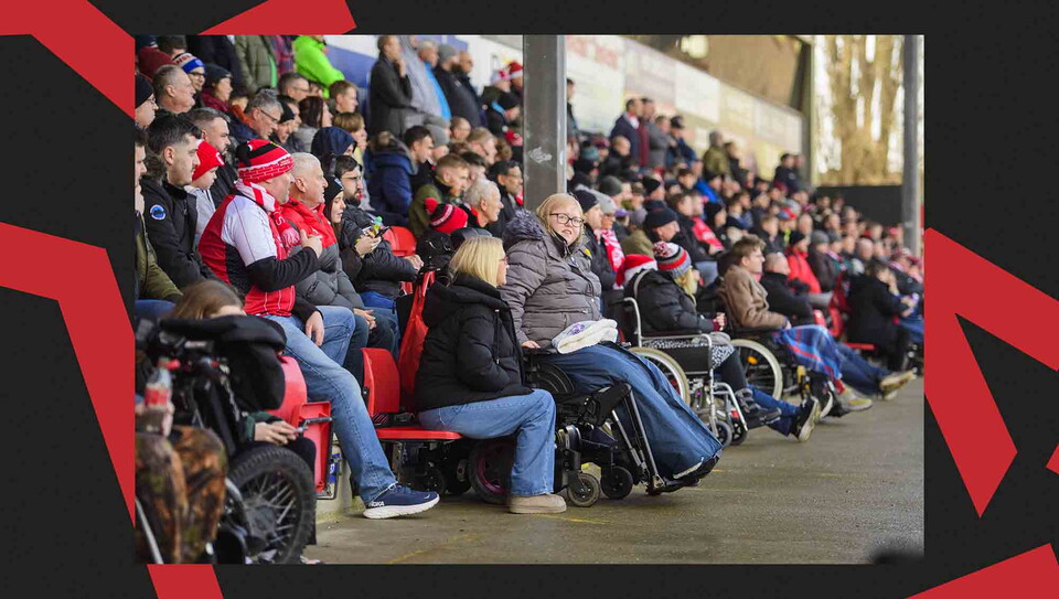 Lincoln City fans watching a game