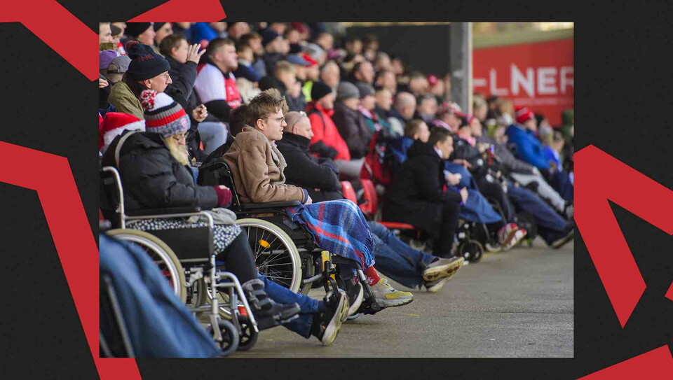 Lincoln City fans watching a game