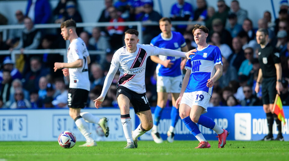 Dom Jefferies in possession of the ball for Lincoln City