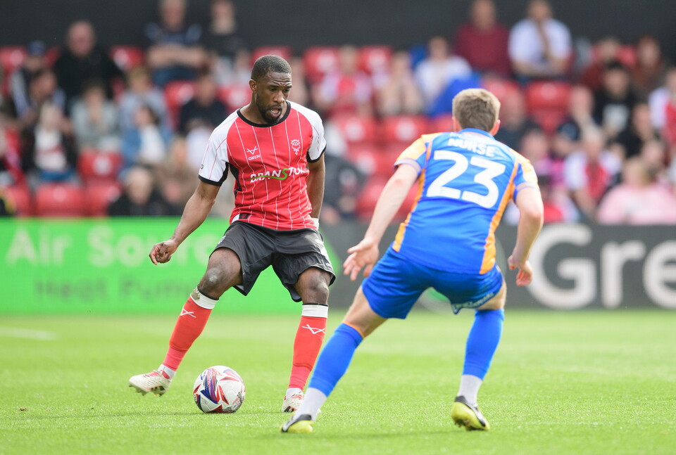 Tendayi Darikwa of Lincoln City and George Nurse of Shrewsbury Town during the EFL Sky Bet League One match between Lincoln City and Shrewsbury Town at LNER Stadium, Lincoln.