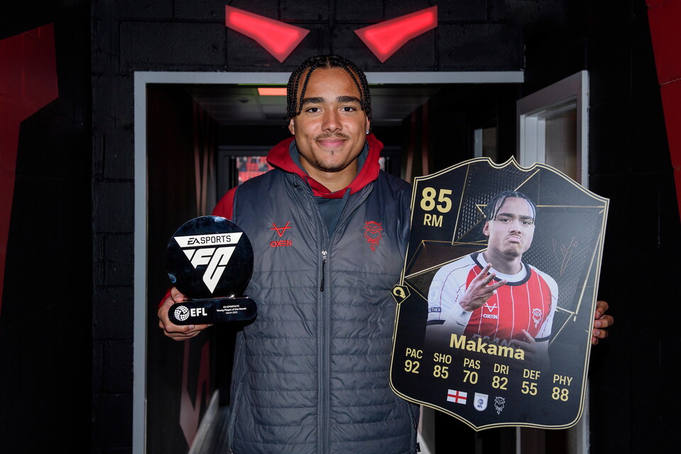 Jovon Makama of Lincoln City with the EA Sports FC Young Player of the Month trophy for March 2025 in the tunnel prior to the EFL Sky Bet League One match between Lincoln City and Bolton Wanderers at LNER Stadium, Lincoln.
