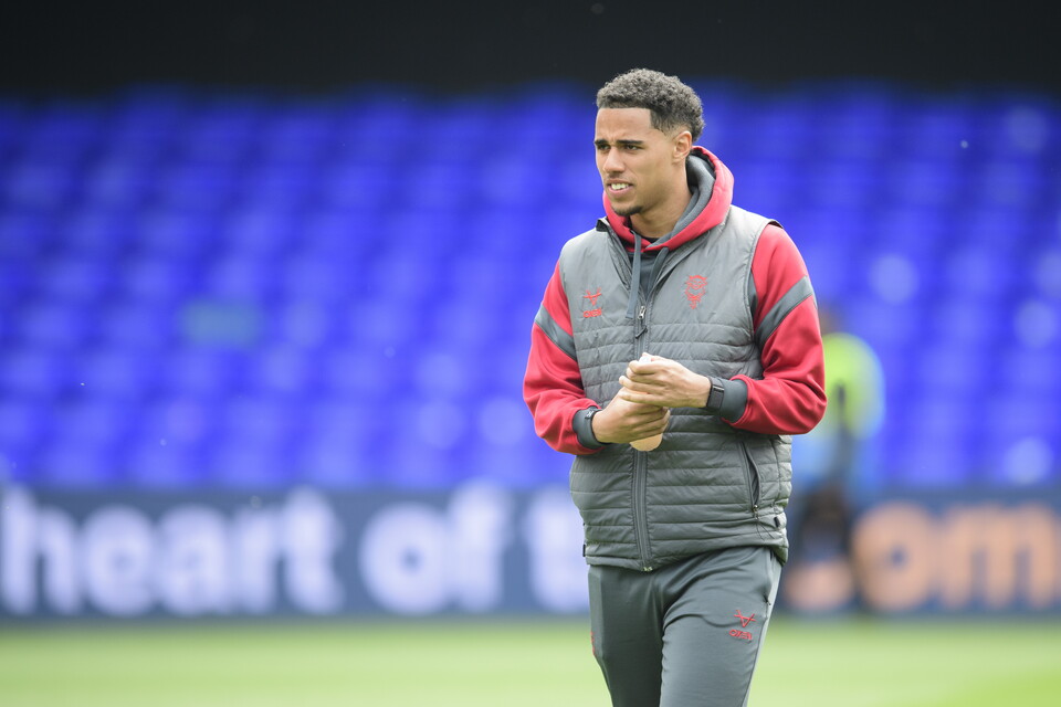 Ethan Erhahon stands on a football pitch