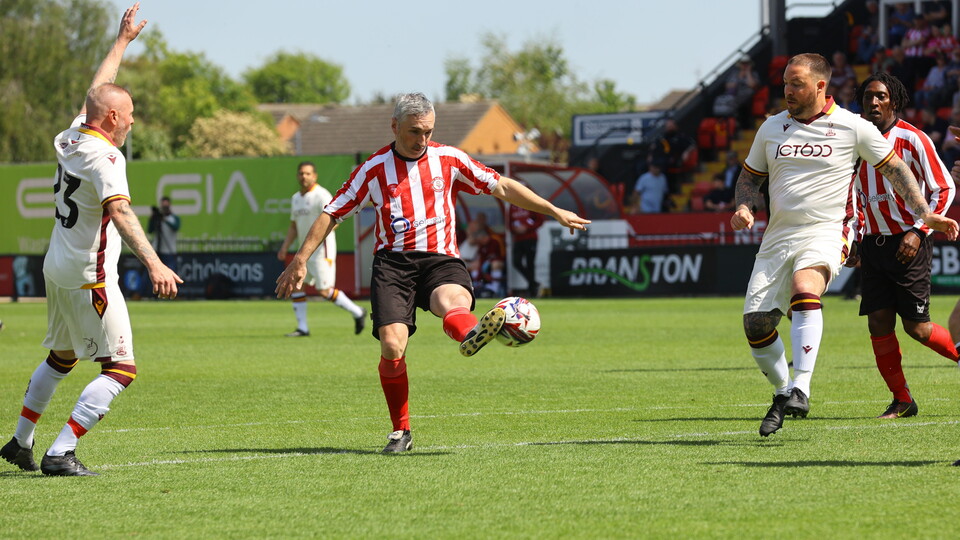 Simon Yeo controls the football