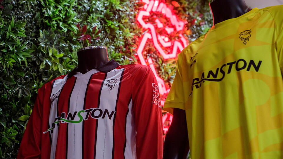 A close up of Lincoln City's home and goalkeeper tops