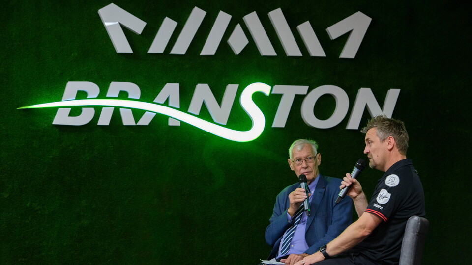 John Helm and Michael Skubala speak on stage