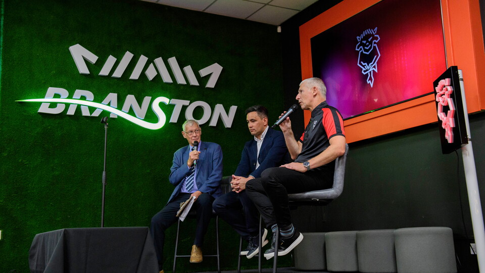 John Helm, Liam Scully and Jez George speak on stage.