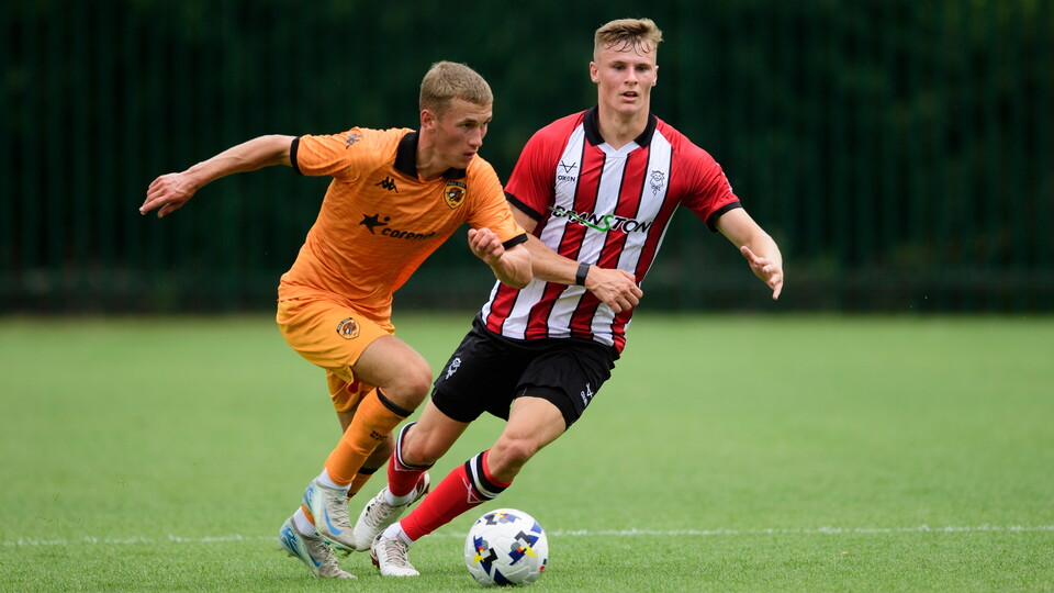 Rob Street closes down a Hull City player