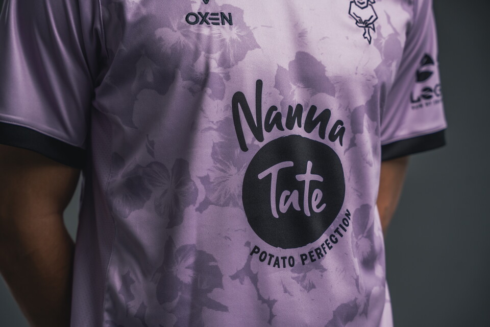 A close-up of the front of the 2025/26 third shirt featuring a black Nanna Tate logo.